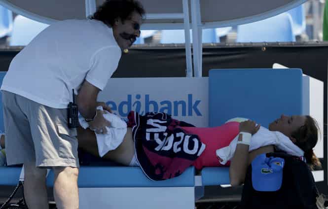 Varvara Lepchenko of the US receives treatment for heat related illness during her second round match against Simona Halep of Romania at the Australian Open in Melbourne. (AP Photo) Varvara Lepchenko of the US receives treatment for heat related illness during her second round match against Simona Halep of Romania at the Australian Open in Melbourne. (AP Photo)