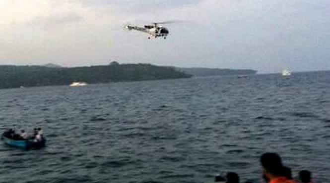 A rescue helicopter searches for survivors after a tourist boat, carrying around 46 people, capsized in the Andaman Sea. (PTI photo)</font></strong) A rescue helicopter searches for survivors after a tourist boat, carrying around 46 people, capsized in the Andaman Sea. (PTI photo)</font></strong)