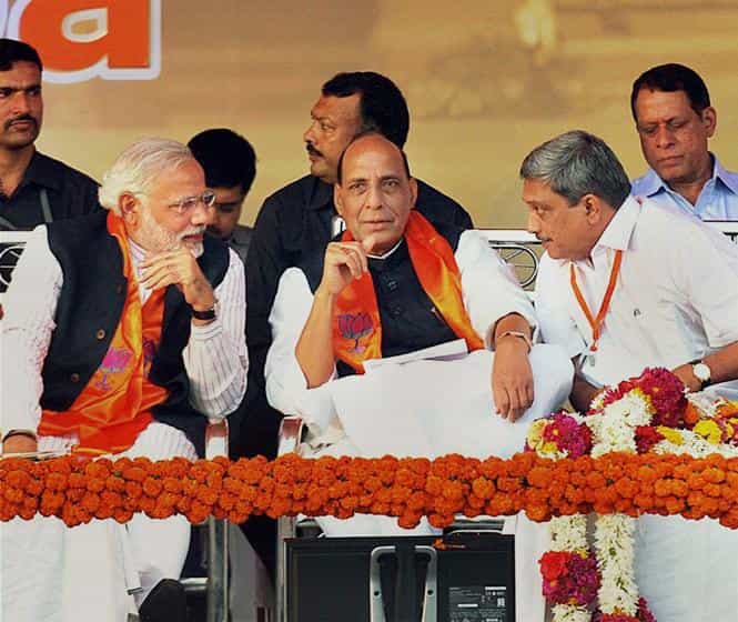 BJP's PM candidate Narendra Modi is seen with party chief Rajnath Singh and Goa CM Manohar Parrikar at BJP's 'Vijay Sankalp' rally in Panaji. (PTI photo)</strong) BJP's PM candidate Narendra Modi is seen with party chief Rajnath Singh and Goa CM Manohar Parrikar at BJP's 'Vijay Sankalp' rally in Panaji. (PTI photo)</strong)