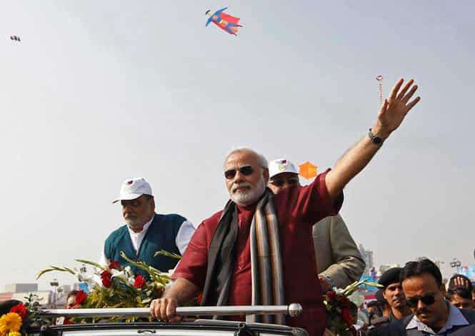 A photo of BJP's PM candidate and Gujarat chief minister Narendra Modi during the international kite festival in Ahmedabad. (Reuters photo)</strong) A photo of BJP's PM candidate and Gujarat chief minister Narendra Modi during the international kite festival in Ahmedabad. (Reuters photo)</strong)