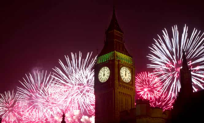 Fireworks explode over the Houses of Parliament, including Queen Elizabeth II tower which holds the bell known as Big Ben as London celebrates the arrival of New Year's Day. (AP Photo)</strong) Fireworks explode over the Houses of Parliament, including Queen Elizabeth II tower which holds the bell known as Big Ben as London celebrates the arrival of New Year's Day. (AP Photo)</strong)