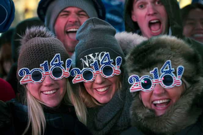 Revelers pose for a photograph as they wait for midnight during the New Year's Eve celebrations in Times Square. (AP photo)</strong) Revelers pose for a photograph as they wait for midnight during the New Year's Eve celebrations in Times Square. (AP photo)</strong)