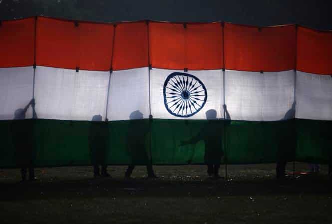 School students painted in the colours of the tricolour perform a dance during Republic Day celebrations in Secunderabad. (AFP photo)</strong)