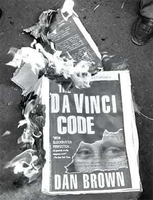 Up in flames: Protestors burning copies of The Da Vinci Code in Mumbai in 2006, to halt the release of the film in India. (Photo: AFP)</font></em></strong> </div) Up in flames: Protestors burning copies of The Da Vinci Code in Mumbai in 2006, to halt the release of the film in India. (Photo: AFP)</font></em></strong> </div)