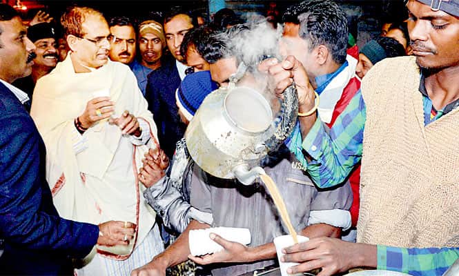 The Shivraj Singh Chouhan-led BJP government has been advertising its achievements, but a major part of the party’s campaign across Madhya Pradesh is playing up its PM candidate Narendra Modi’s ‘tea-seller-to-chief-minister’ life story. (PTI file photo)
</div) The Shivraj Singh Chouhan-led BJP government has been advertising its achievements, but a major part of the party’s campaign across Madhya Pradesh is playing up its PM candidate Narendra Modi’s ‘tea-seller-to-chief-minister’ life story. (PTI file photo)
</div)