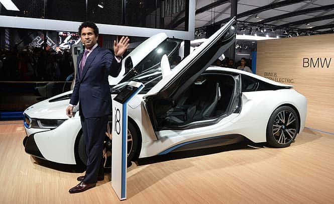Sachin poses with the newly launched BMW i8 at the Auto Expo. (AFP Photo) BMW launches its vision for future: the i8 concept supercar