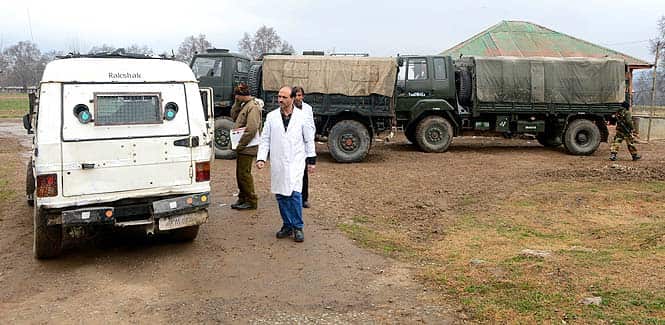 Medics leave an army camp after conducting a post-mortem examination on the bodies of five soldiers killed inside a army camp at Safapora some 20 kms (12 miles) from Srinagar (AFP photo)</strong) Medics leave an army camp after conducting a post-mortem examination on the bodies of five soldiers killed inside a army camp at Safapora some 20 kms (12 miles) from Srinagar (AFP photo)</strong)