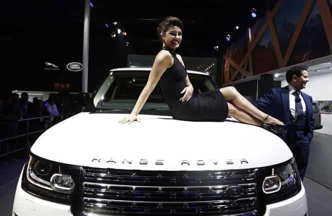 Bollywood actress Priyanka Chopra poses with Jaguar Land Rover's Range Rover LWB during its launch at the Auto Expo in Greater Noida. (Reuters Photo) Seventy cars and bikes launched but, Auto Expo lacks fizz this year