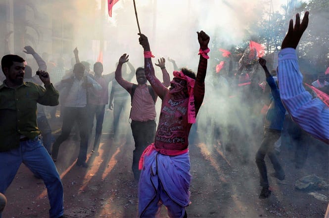 TRS supporters dance as they celebrate the passage of Telangana bill in the Lok Sabha, in Hyderabad. (PTI Photo) TRS supporters dance as they celebrate the passage of Telangana bill in the Lok Sabha, in Hyderabad. (PTI Photo)