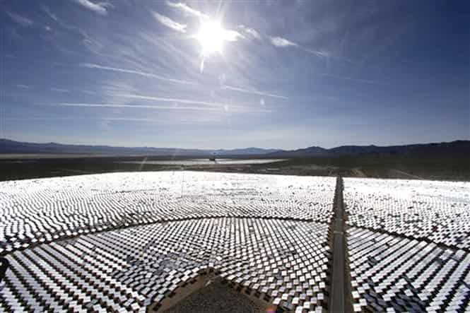 Some of the 300,000 computer-controlled mirrors, each about 7 feet high and 10 feet wide, reflect sunlight to boilers that sit on 459-foot towers. (AP photo) Some of the 300,000 computer-controlled mirrors, each about 7 feet high and 10 feet wide, reflect sunlight to boilers that sit on 459-foot towers. (AP photo)