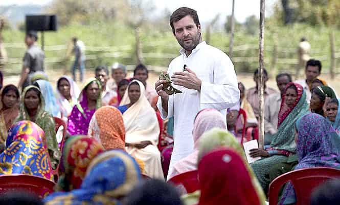 Congress vice-president Rahul Gandhi during interaction with a group of women who collect tendu leaves at a village in Mandla, Madhya Pradesh. (PTI Photo)
</div) Congress vice-president Rahul Gandhi during interaction with a group of women who collect tendu leaves at a village in Mandla, Madhya Pradesh. (PTI Photo)
</div)