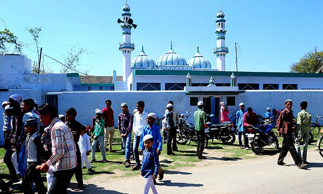 Muslim devotees return home after offering Friday prayers at Jama Masjid in Ayodhya. (AFP photo) Muslim devotees return home after offering Friday prayers at Jama Masjid in Ayodhya. (AFP photo)