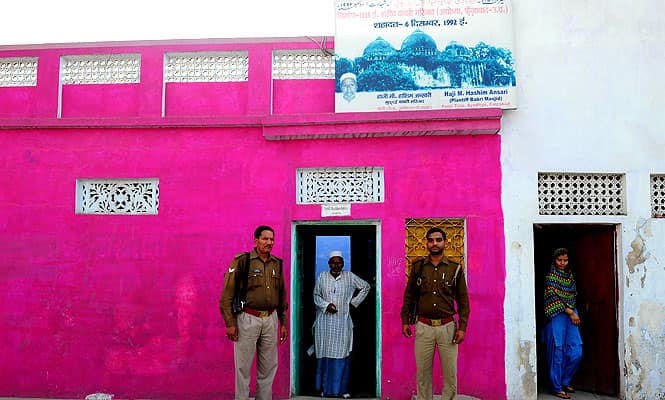 Haji Hashim Ansari(C), the main plaintiff in the Babri Masjid case, is flanked by policemen at his home in Ayodhya. (AFP photo) Haji Hashim Ansari(C), the main plaintiff in the Babri Masjid case, is flanked by policemen at his home in Ayodhya. (AFP photo)