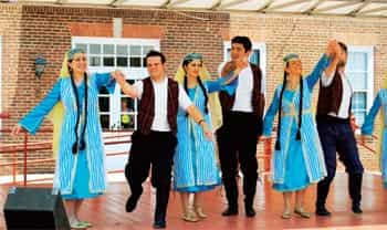 Armenian men and women performing a traditional dance Armenian men and women performing a traditional dance