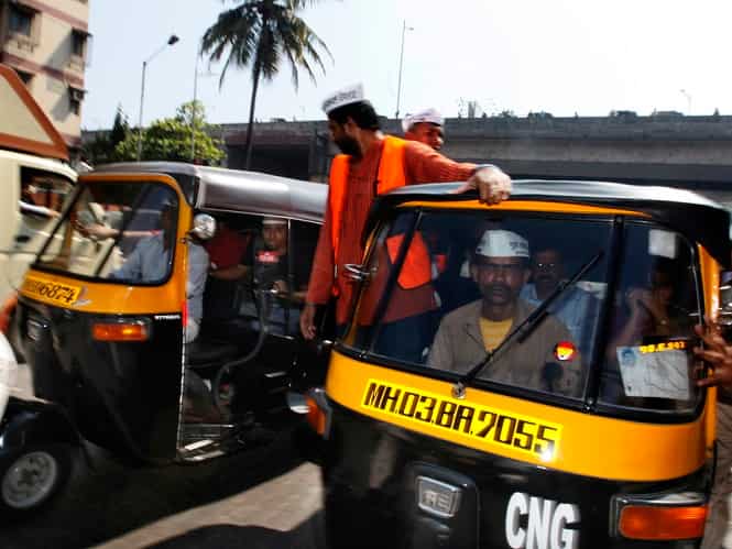 Aam Aadmi Party supporters travel in autos along with party leader Arvind Kejriwal who is in Mumbai to campaign for party candidates ahead of Lok Sabha polls. (Satish Bate/HT Photo)</em) Aam Aadmi Party supporters travel in autos along with party leader Arvind Kejriwal who is in Mumbai to campaign for party candidates ahead of Lok Sabha polls. (Satish Bate/HT Photo)</em)
