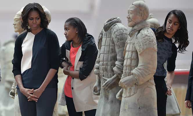 US first lady Michelle Obama and daughters Sasha and Malia look at the Terracotta Warriors in China's central Shaanxi province of Xian. (AFP photo)
</div) US first lady Michelle Obama and daughters Sasha and Malia look at the Terracotta Warriors in China's central Shaanxi province of Xian. (AFP photo)
</div)