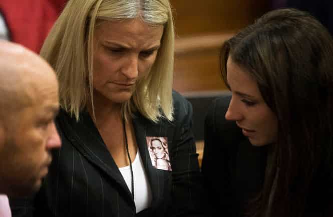 Oscar Pistorius' sister, Aimee (R) speaks with unidentified members of Reeva Steenkamp's family. (AP Photo) Oscar Pistorius' sister, Aimee (R) speaks with unidentified members of Reeva Steenkamp's family. (AP Photo)
