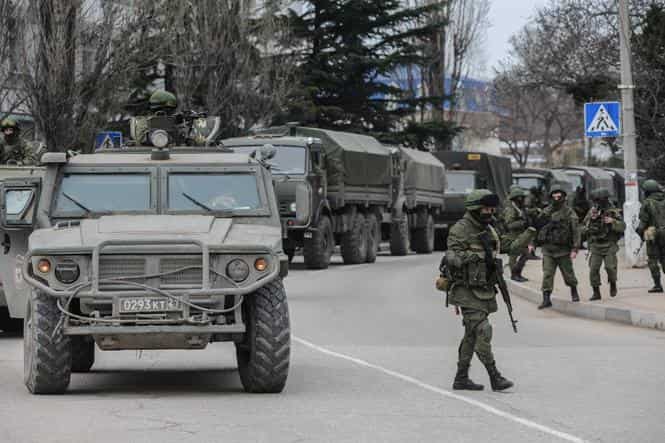 An emblem on one of the vehicles and their number plates identify the troops as belonging to the Russian military on the outskirts of Sevastopol, Ukraine. (AP photo)</strong) An emblem on one of the vehicles and their number plates identify the troops as belonging to the Russian military on the outskirts of Sevastopol, Ukraine. (AP photo)</strong)