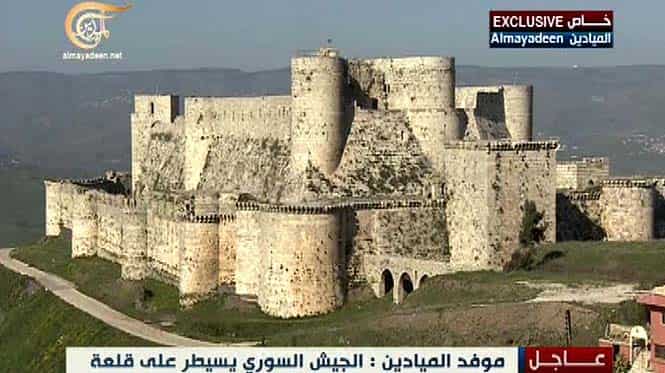 An image grab taken from Lebanon's Al-Mayadeen TV shows the Crusader fort of Krak des Chevaliers was taken by Syrian regime forces, killing dozens of rebels in the surrounding area and sending scores fleeing across the nearby Lebanese border. (AFP file photo)</em) An image grab taken from Lebanon's Al-Mayadeen TV shows the Crusader fort of Krak des Chevaliers was taken by Syrian regime forces, killing dozens of rebels in the surrounding area and sending scores fleeing across the nearby Lebanese border. (AFP file photo)</em)