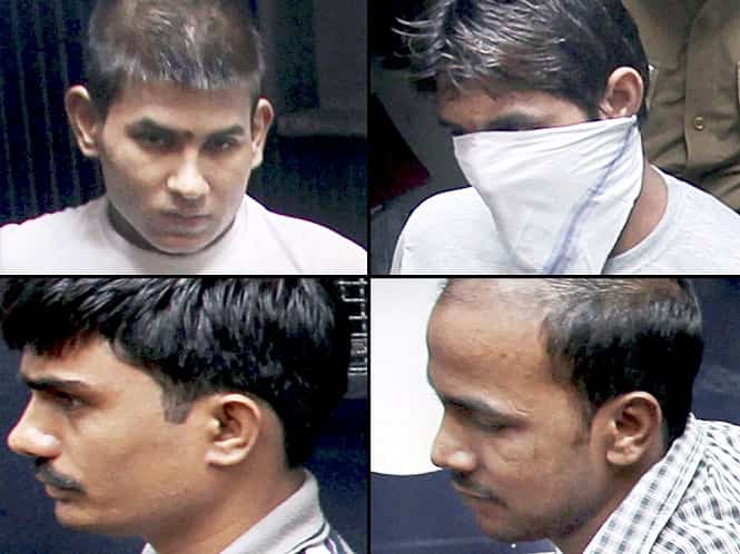 File photo: Gang-rape convicts Vinay Sharma, Pawan Gupta (face covered), Akshay Thakur and Mukesh Singh (clockwise from left) being taken to high court in New Delhi. (PTI Photo)</em) File photo: Gang-rape convicts Vinay Sharma, Pawan Gupta (face covered), Akshay Thakur and Mukesh Singh (clockwise from left) being taken to high court in New Delhi. (PTI Photo)</em)