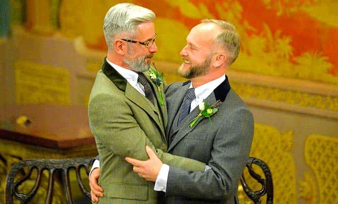 Andrew Wale (L) and Neil Allard (R) embrace after exchanging rings during their wedding ceremony at the Royal Pavillion in Brighton. (AFP photo)</em) Andrew Wale (L) and Neil Allard (R) embrace after exchanging rings during their wedding ceremony at the Royal Pavillion in Brighton. (AFP photo)</em)