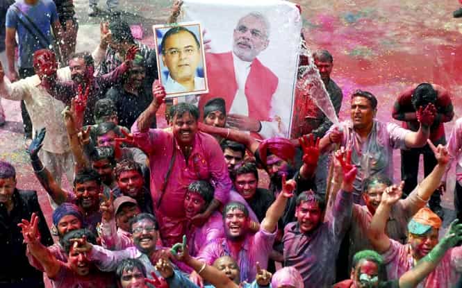 BJP activists celebrate Holi with the photographs of party leaders Narendra Modi and Arun Jaitley in Amritsar. (PTI photo) BJP activists celebrate Holi with the photographs of party leaders Narendra Modi and Arun Jaitley in Amritsar. (PTI photo)