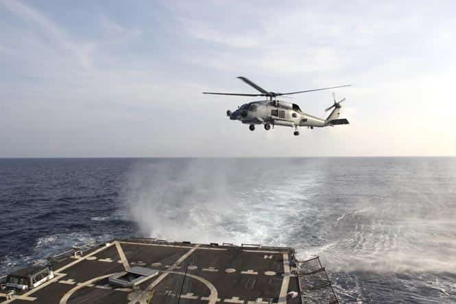 A US Navy SH-60R Seahawk helicopter takes off from the destroyer USS Pinckney in the Gulf of Thailand, to assist in the search for missing Malaysian Airlines flight MH370. (Reuters) A US Navy SH-60R Seahawk helicopter takes off from the destroyer USS Pinckney in the Gulf of Thailand, to assist in the search for missing Malaysian Airlines flight MH370. (Reuters)