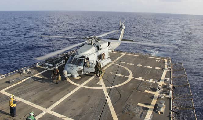 A U.S. Navy SH-60R Seahawk helicopter lands on the destroyer USS Pinckney in the Gulf of Thailand, during operations in the search for missing Malaysian Airlines flight MH370. (Reuters Photo) A U.S. Navy SH-60R Seahawk helicopter lands on the destroyer USS Pinckney in the Gulf of Thailand, during operations in the search for missing Malaysian Airlines flight MH370. (Reuters Photo)
