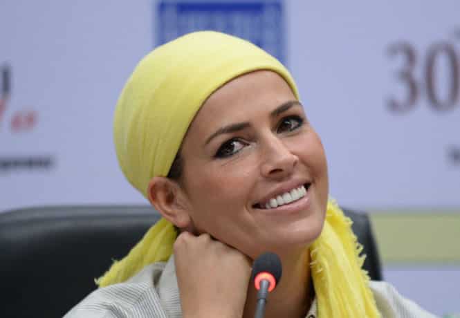 Former Miss World Linor Abargil of Israel looks on during a function to celebrate International Women's Day in New Delhi. (AFP photo)</em) Former Miss World Linor Abargil of Israel looks on during a function to celebrate International Women's Day in New Delhi. (AFP photo)</em)