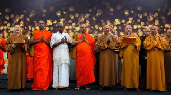 Buddhist monks offer a special prayer for passengers aboard a missing plane, at Kuala Lumpur International Airport in Sepang, Malaysia. (AP file photo)</strong) Buddhist monks offer a special prayer for passengers aboard a missing plane, at Kuala Lumpur International Airport in Sepang, Malaysia. (AP file photo)</strong)
