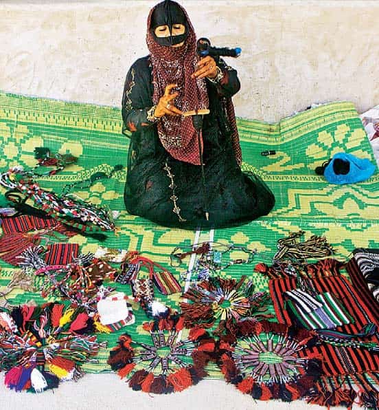A woman selling traditional handicrafts A woman selling traditional handicrafts