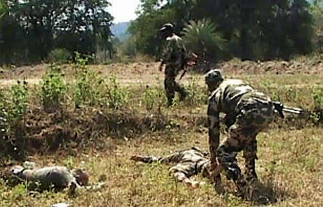 Security personnel near the bodies of their colleagues after Maoists attacked a joint search party of CRPF and the police near Tongpal in Sukma district of Chhattisgarh. PTI Photo Security personnel near the bodies of their colleagues after Maoists attacked a joint search party of CRPF and the police near Tongpal in Sukma district of Chhattisgarh. PTI Photo