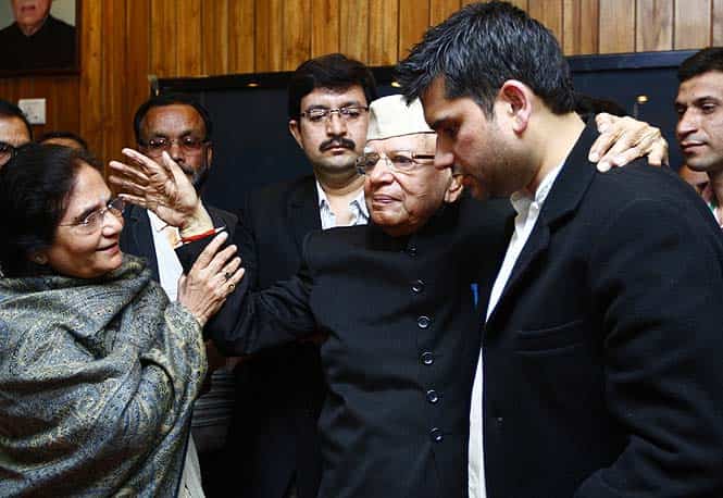 Veteran Congress politician ND Tiwari, who finally accepted a young man named Rahul Shekhar (R) as his son, hugs him at Uttrakhand Bhawan in New Delhi. (Arun Sharma/HT photo)
</div) Veteran Congress politician ND Tiwari, who finally accepted a young man named Rahul Shekhar (R) as his son, hugs him at Uttrakhand Bhawan in New Delhi. (Arun Sharma/HT photo)
</div)