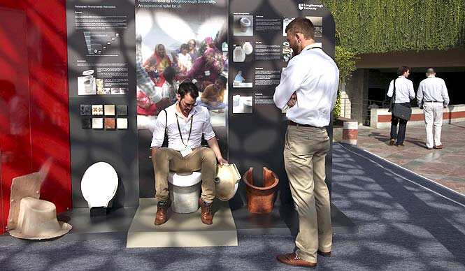 An exhibitor from Loughborough University demonstrates the use of a toilet during Reinvent The Toilet Fair in New Delhi. (AP Photo) An exhibitor from Loughborough University demonstrates the use of a toilet during Reinvent The Toilet Fair in New Delhi. (AP Photo)
