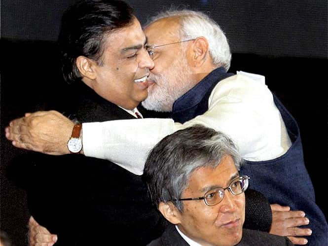 Gujarat chief minister Narendra Modi hugs industrialist Mukesh Ambani at the Vibrant Gujarat Global Investors Summit 2013 in Gandhinagar. (PTI photo) Gujarat chief minister Narendra Modi hugs industrialist Mukesh Ambani at the Vibrant Gujarat Global Investors Summit 2013 in Gandhinagar. (PTI photo)