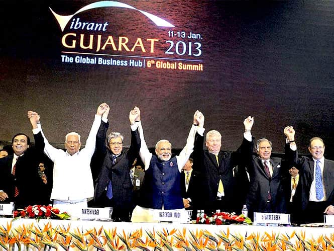 Gujarat chief minister Narendra Modi raises hands with industrialist Mukesh Ambani, Vajubhai Vala, Japanese TC director Takeshi Yagi, Canadian High Commissoner Stewart Beck and Ratan Tata at the Vibrant Gujarat Global Investors Summit 2013 in Gandhinagar. (PTI photo) Gujarat chief minister Narendra Modi raises hands with industrialist Mukesh Ambani, Vajubhai Vala, Japanese TC director Takeshi Yagi, Canadian High Commissoner Stewart Beck and Ratan Tata at the Vibrant Gujarat Global Investors Summit 2013 in Gandhinagar. (PTI photo)