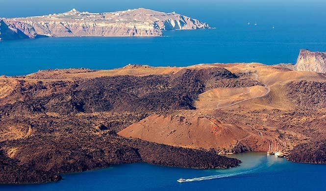 Nea Kameni, a volcanic mount on the Santorini Caldera, is a relatively easy climb even for amateur hikers Nea Kameni, a volcanic mount on the Santorini Caldera, is a relatively easy climb even for amateur hikers