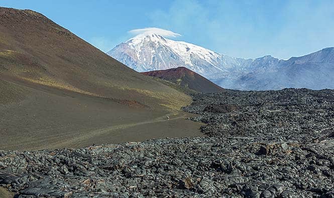 The enormous Kamchatka Mountains are located in Eastern Russia, between the Bering and Okhotsk Seas The enormous Kamchatka Mountains are located in Eastern Russia, between the Bering and Okhotsk Seas