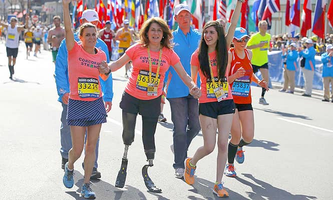 2013 Boston Marathon survivors Celeste Corcoran (C)and her daughter Sydney (R)finish the race with Celeste's sister Carmen Acabbo, who ran the 118th Boston Marathon, in Boston, Massachusetts. (Reuters)</em) 2013 Boston Marathon survivors Celeste Corcoran (C)and her daughter Sydney (R)finish the race with Celeste's sister Carmen Acabbo, who ran the 118th Boston Marathon, in Boston, Massachusetts. (Reuters)</em)