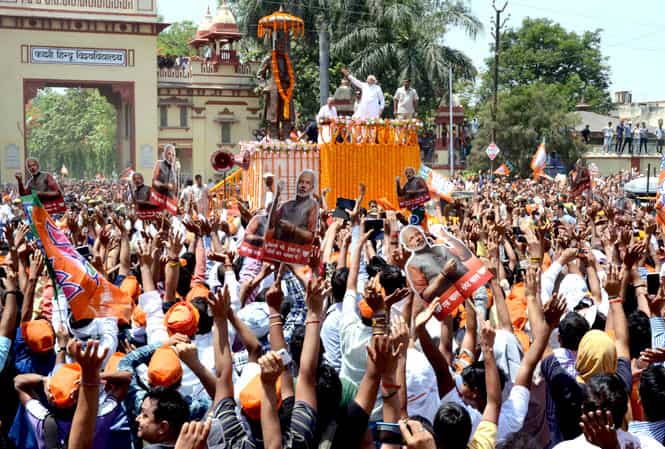 BJP's PM candidate Narendra Modi gestures to supporters during a rally in Varanasi. AFP photo BJP's PM candidate Narendra Modi gestures to supporters during a rally in Varanasi. AFP photo