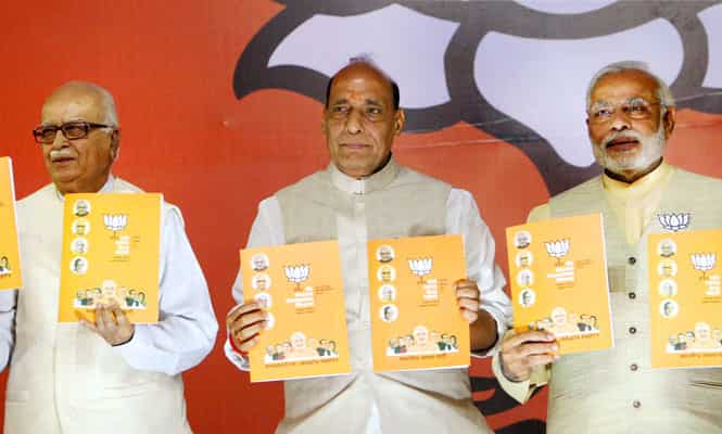 Bharatiya Janata Party's prime ministerial candidate Narendra Modi, party president Rajnath Singh and senior leader Lal Krishna Advani release the party's election manifesto in New Delhi. (PTI Photo)
</div) Bharatiya Janata Party's prime ministerial candidate Narendra Modi, party president Rajnath Singh and senior leader Lal Krishna Advani release the party's election manifesto in New Delhi. (PTI Photo)
</div)