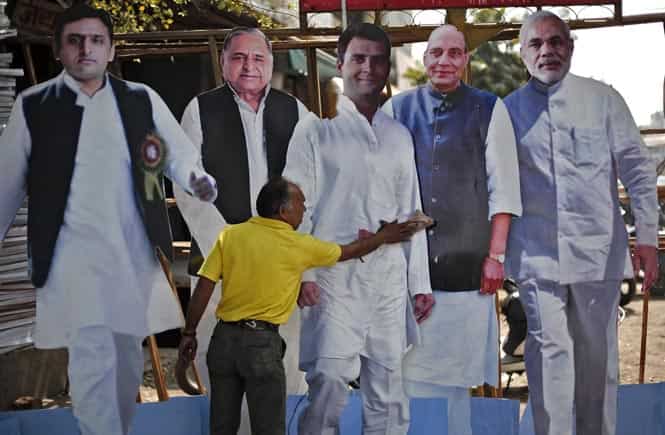 A worker cleans a cut-out of Rahul Gandhi, UP CM Akhilesh Yadav, SP chief Mulayam Singh Yadav, BJP president Rajnath Singh and BJP's PM nominee Narendra Modi as they are put on display for sale ahead of general elections in Ghaziabad. (Reuters photo)</em) A worker cleans a cut-out of Rahul Gandhi, UP CM Akhilesh Yadav, SP chief Mulayam Singh Yadav, BJP president Rajnath Singh and BJP's PM nominee Narendra Modi as they are put on display for sale ahead of general elections in Ghaziabad. (Reuters photo)</em)