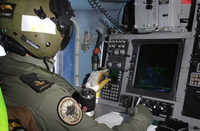 This photo released by Australian defence shows HMAS Toowoomba's S-70B-2 Seahawk helicopter, Tiger 75, during the search for missing Malaysia Airways Flight MH370. (AFP photo/Australian Defence/Abis Chris Beerens)
</div) This photo released by Australian defence shows HMAS Toowoomba's S-70B-2 Seahawk helicopter, Tiger 75, during the search for missing Malaysia Airways Flight MH370. (AFP photo/Australian Defence/Abis Chris Beerens)
</div)