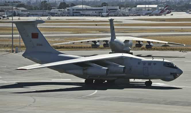 A Chinese Ilyushin IL-76s aircraft taxies past a sister plane at Perth International Airport after assisting in the on-going search operation for missing Malaysia Airlines flight MH370. (AFP photo)
</div) A Chinese Ilyushin IL-76s aircraft taxies past a sister plane at Perth International Airport after assisting in the on-going search operation for missing Malaysia Airlines flight MH370. (AFP photo)
</div)