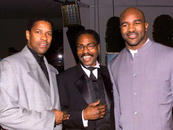 Rubin 'Hurricane' Carter (C) poses with actor Denzel Washington (L) and boxing champion Evander Holyfield at the premier of the film The Hurricane in December, 1999. (Reuters Photo)