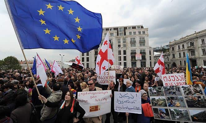 People rally in Tbilisi against Georgia's cooperation with Russia and to condemn what they call 'Moscow's involvement in Ukraine.' (AFP photo)
</div) People rally in Tbilisi against Georgia's cooperation with Russia and to condemn what they call 'Moscow's involvement in Ukraine.' (AFP photo)
</div)