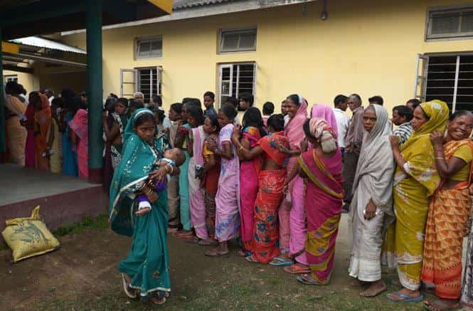 Voters wait in line outside a polling station in Dibrugarh during Lok Sabha elections. (AFP photo)</em) Voters wait in line outside a polling station in Dibrugarh during Lok Sabha elections. (AFP photo)</em)