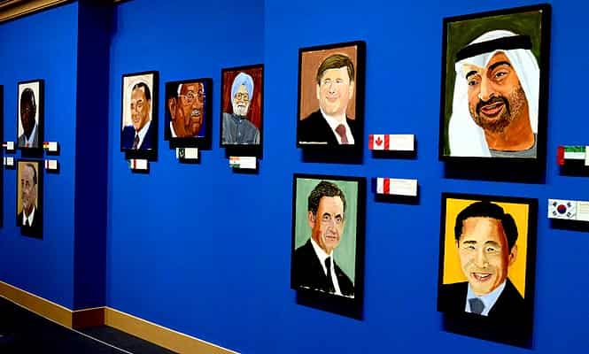 Portraits of world leaders which are part of the exhibit "The Art of Leadership: A President's Diplomacy," are on display at the George W. Bush Presidential Library and Museum in Dallas (AP photo)</em)
