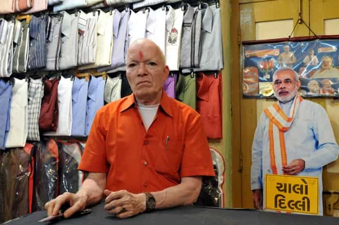Sangam tailor proprietor Kanahiya Ji Chouhan (71), who still stitches Narendra Modi’s kurta in Dahod,Gujarat. (HT photo/Amit K Jaiswal)</em) Sangam tailor proprietor Kanahiya Ji Chouhan (71), who still stitches Narendra Modi’s kurta in Dahod,Gujarat. (HT photo/Amit K Jaiswal)</em)
