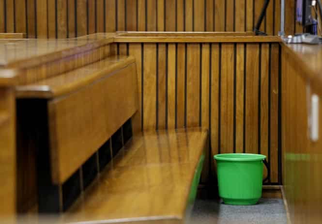 A picture taken on April 8, 2013 shows a bucket next to the sit of South African Paralympic track star Oscar Pistorius, during his trial in a court in Pretoria. (AFP photo) A picture taken on April 8, 2013 shows a bucket next to the sit of South African Paralympic track star Oscar Pistorius, during his trial in a court in Pretoria. (AFP photo)